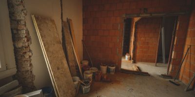 pexels photo 15798782 15798782 A red brick wall under construction with tools and materials scattered around in a renovation project.