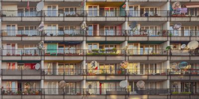 pexels photo 17215523 17215523 Photograph of a residential building with colorful balconies and satellite dishes in Berlin.